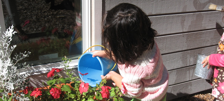 small girl with flowers